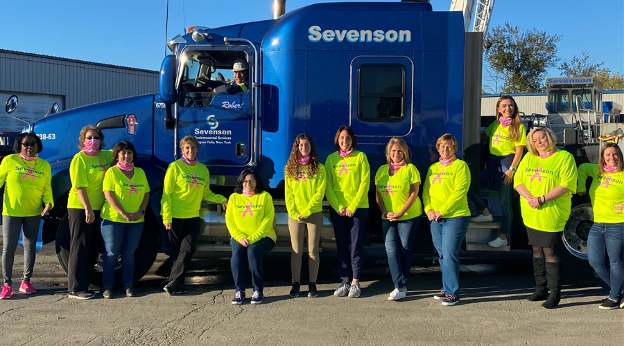 The sevenson team standing in front of a rig